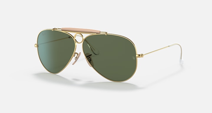 Ray-Ban aviator sunglasses with gold frame and dark green lenses, pink temple tips