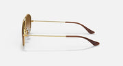 Gold aviator sunglasses side view with metal temples and brown lens edge
