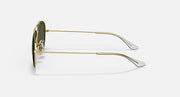 Gold metal sunglasses side profile with olive-tinted lens and slim arms.
