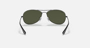 Gunmetal oval sunglasses with green lenses and curved rim detailing