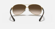Aviator sunglasses with dark gunmetal frame and light brown gradient lenses
