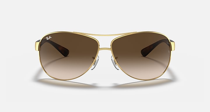 Aviator sunglasses with gold frame and brown gradient lenses, front view
