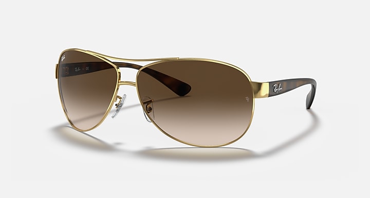 Ray-Ban aviator sunglasses, gold frame with dark brown gradient lenses