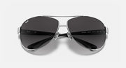 Aviator sunglasses with silver frame and dark gray gradient lenses, close front