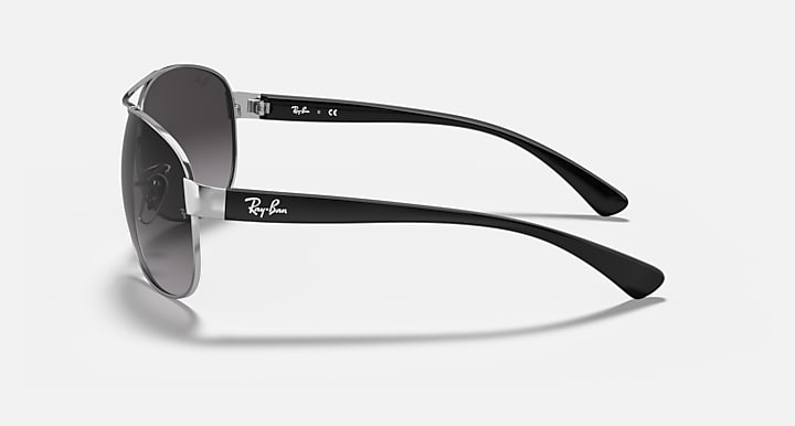 Aviator sunglasses with silver frame, dark lenses, and tortoiseshell temples