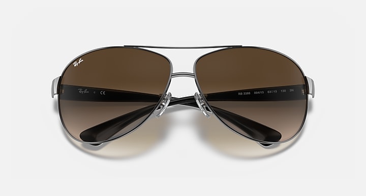 Ray-Ban aviator sunglasses, gunmetal frame with dark brown gradient lenses
