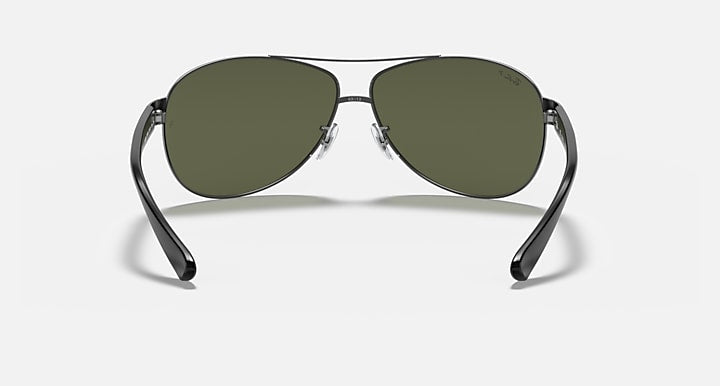 Ray-Ban aviator sunglasses with green lenses and silver metal frame, straight-on view.