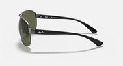 Ray-Ban aviator sunglasses with green lenses, silver frame and black temple arms.