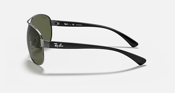 Ray-Ban aviator sunglasses with green lenses, silver frame and black temple arms.