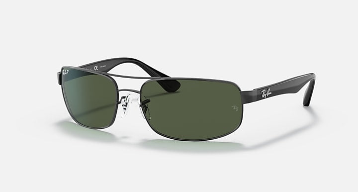 Rectangular sunglasses with black frame and dark green lenses