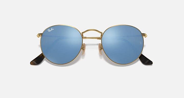 Round Ray-Ban sunglasses with gold frame, blue gradient lenses, black temple tips