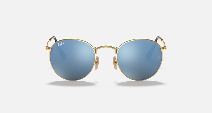 Round Ray-Ban sunglasses with gold frame, teal gradient lenses, curved bridge