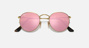 Ray-Ban RB3447N round sunglasses with gold frames and pink gradient mirrored lenses