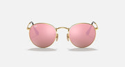 Ray-Ban RB3447N round sunglasses with gold frames and pink tinted lenses