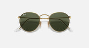 Ray-Ban RB3447N round sunglasses with gold frames and dark green gradient lenses