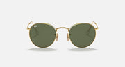 Ray-Ban RB3447N round sunglasses with gold frames and green tinted lenses