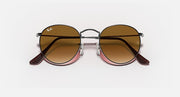 Ray-Ban RB3447N round sunglasses with silver frame, brown lenses, dark brown temples