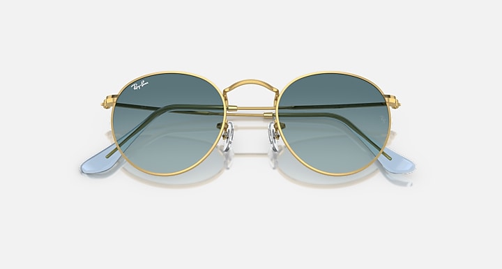 Ray-Ban round metal sunglasses with gold frame and blue-tinted mirrored lenses