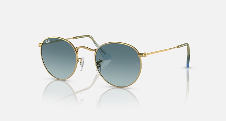 Ray-Ban round metal sunglasses with gold frame and blue-tinted gradient lenses