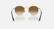 Ray-Ban round metal sunglasses front view, gold frame with brown gradient lenses