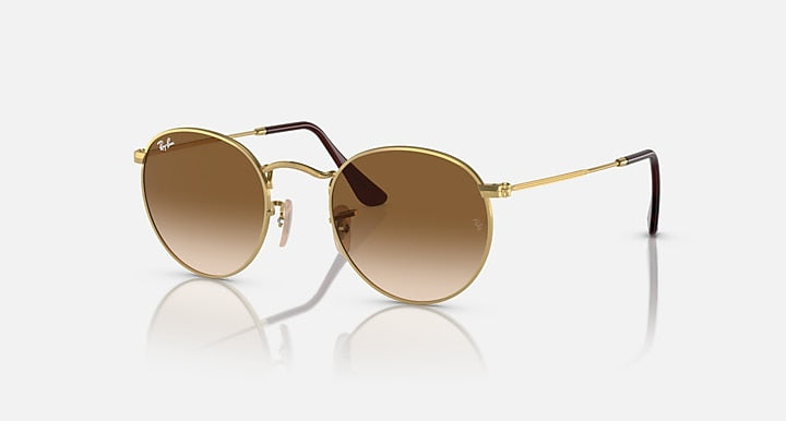 Ray-Ban round metal sunglasses with gold frame and brown gradient lenses