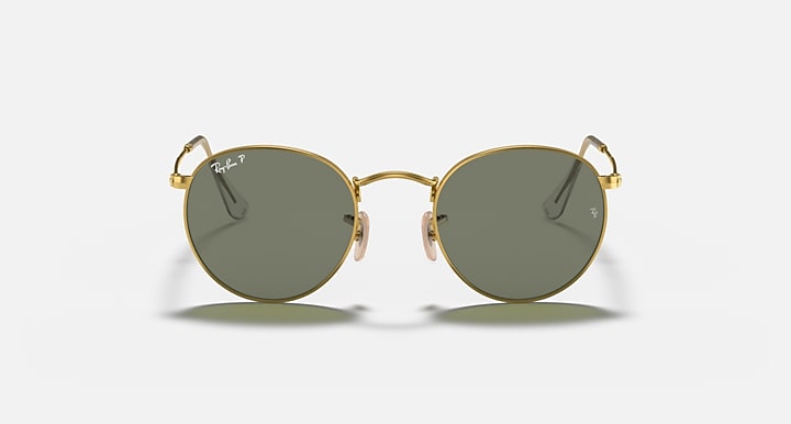 Round metal sunglasses with gold frame and dark green mirrored lenses, front view.