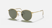 Round metal sunglasses with gold frame and dark green mirrored lenses, side profile view.