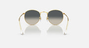 Round metal sunglasses with gold frames and dark lenses, full front view.