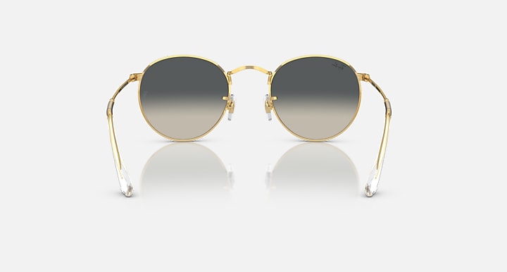 Round metal sunglasses with gold frames and dark lenses, full front view.