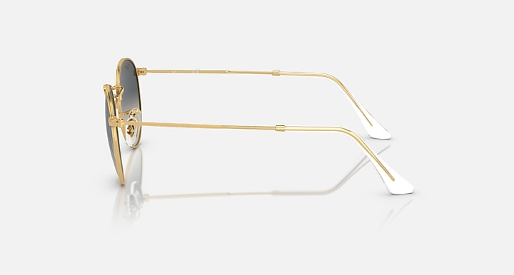 Round metal sunglasses with gold frames, side profile and adjustable temple tips.