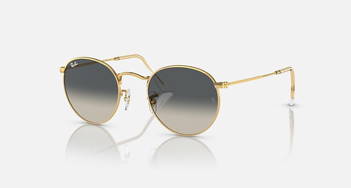 Round metal sunglasses with gold frames and dark mirrored lenses.