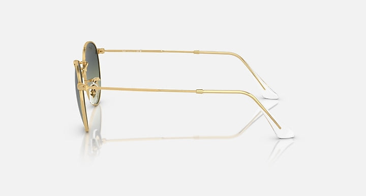 Round metal sunglasses by Ray-Ban, gold frames, side profile with round lenses