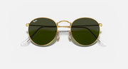 Gold metal round sunglasses with dark lenses and clear temple tips