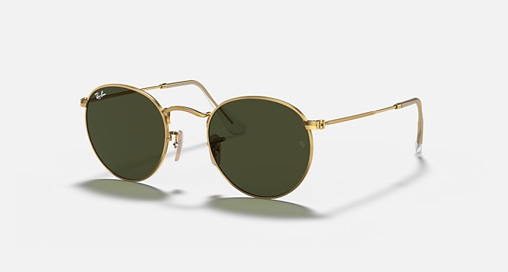 Gold metal round sunglasses with dark green lenses and clear nose pads