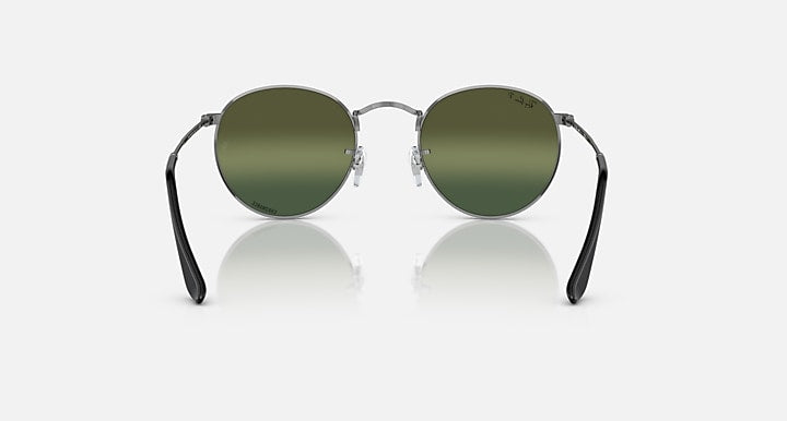 Round metal sunglasses with dark green lenses and black temple arms, front view