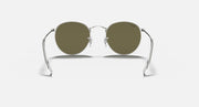 Round metal sunglasses with silver frame and olive tinted lenses
