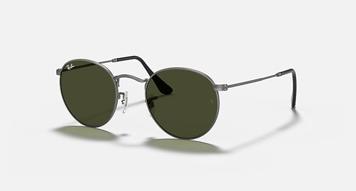Ray-Ban round metal sunglasses with dark green lenses and dark arms