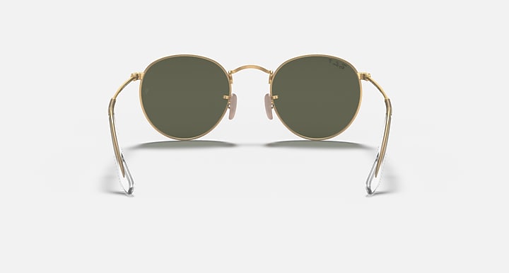 Round metal sunglasses with gold frame, round dark green lenses, and hinged temples