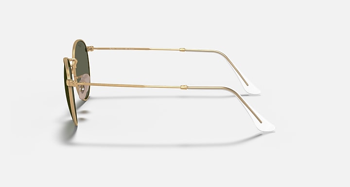 Round metal sunglasses side profile with gold metal frame and dark lenses