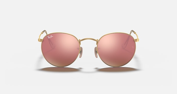 Round metal sunglasses with gold frame and rose-pink mirrored lenses