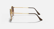 Round metal sunglasses side view with gold frame and brown tinted lenses