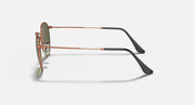Round metal sunglasses side view with rose-gold frame and olive tinted lenses