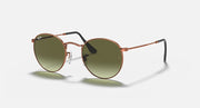 Round metal sunglasses with rose-gold frame and olive tinted lenses, straight arms
