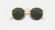 Round metal sunglasses with gold frame and dark lenses, front view with reflective tint.