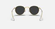 Gold round metal sunglasses with dark smoke lenses and clear temple arms, front view.