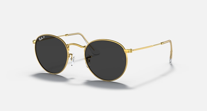 Gold round metal sunglasses with dark smoke lenses and slim clear nose pads.