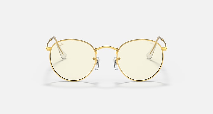 Round metal sunglasses front view with light gold frames and pale tinted lenses