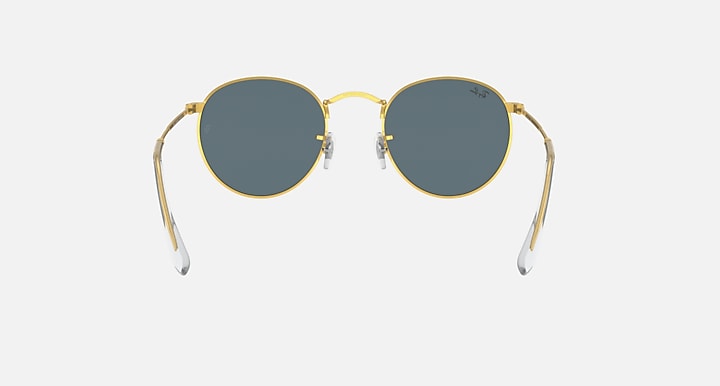 Gold round metal sunglasses with blue-tinted lenses and clear temple arms, front view.