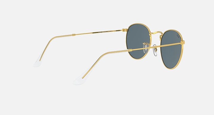 Gold round metal sunglasses with blue-tinted lenses, angled view showing temples.