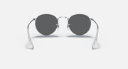 Round metal sunglasses with dark gray lenses and shiny silver frame, front view.